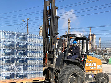 Graphic: forklift carrying palette of water bottles