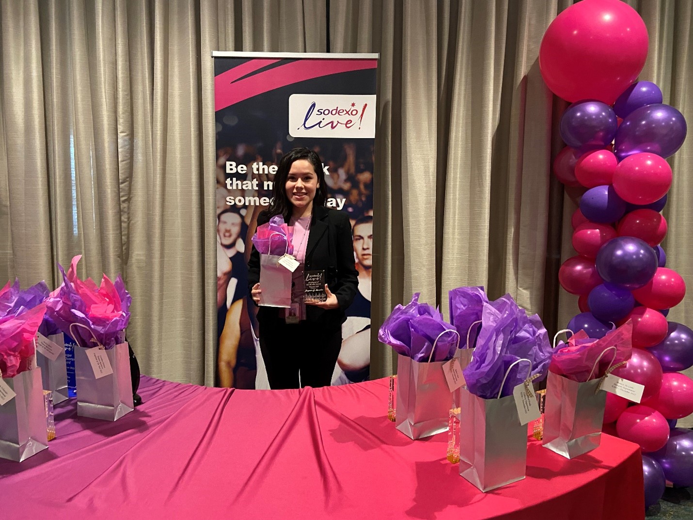 Sodexo live event young woman receiving gif pink balloons