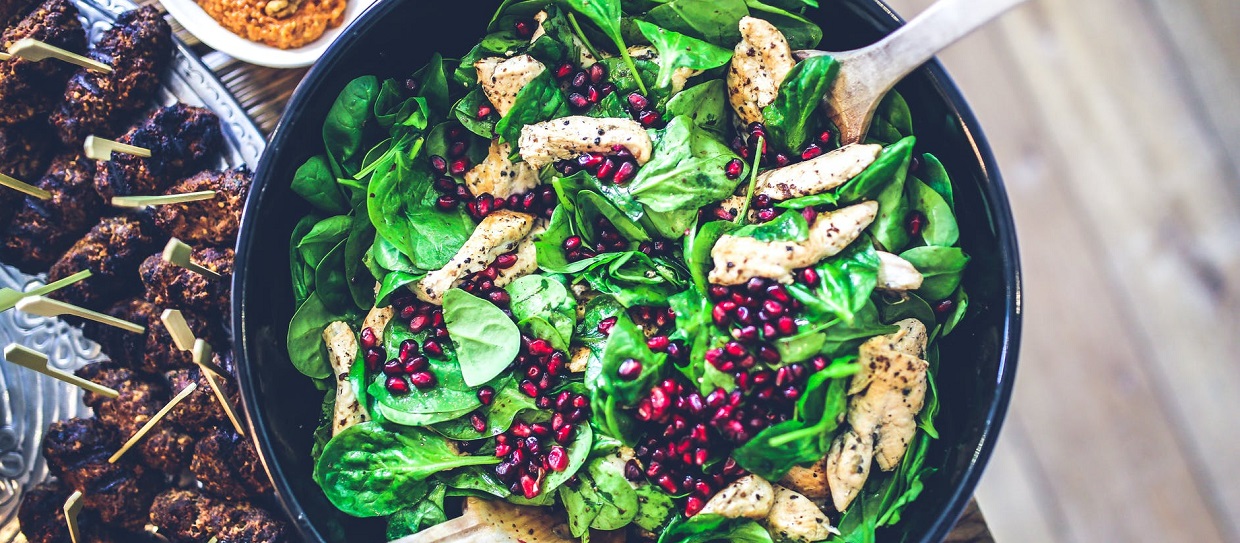 Bowl of salad with chicken and cranberries